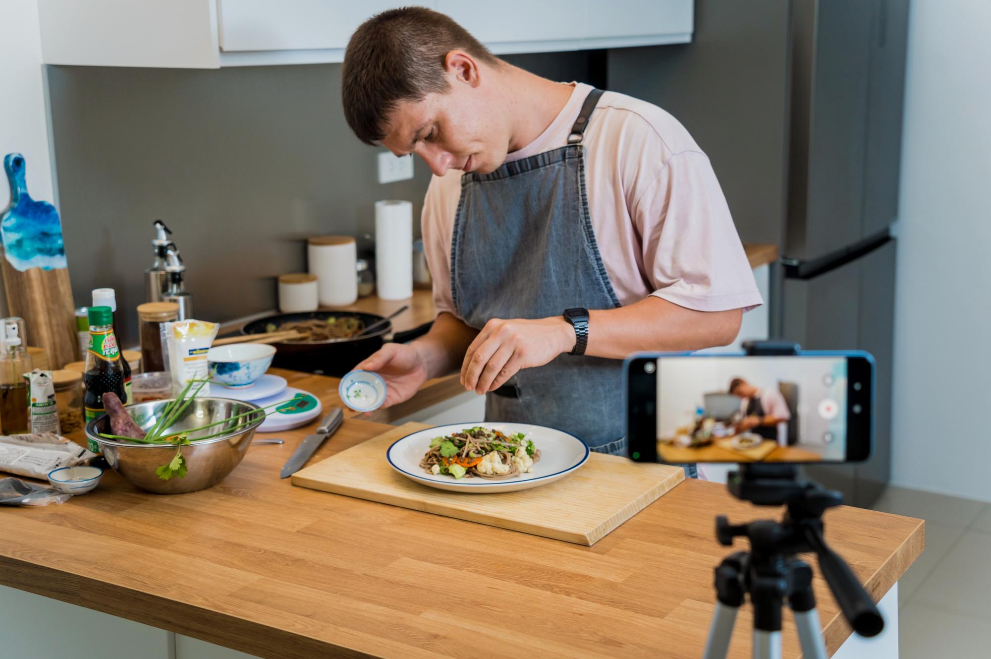 Chef demonstrating a quick meal in a calm studio